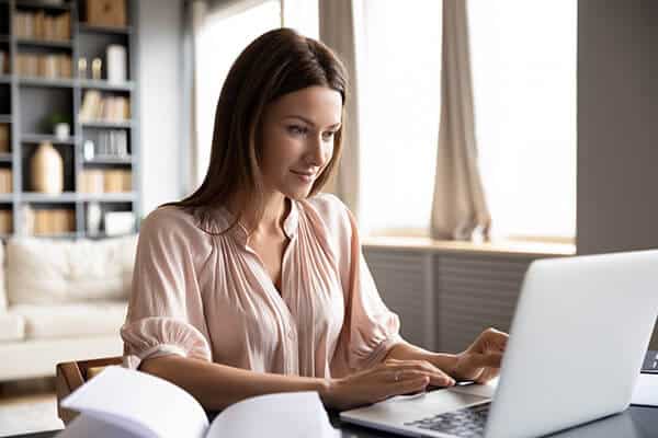 woman typing on a laptop computer